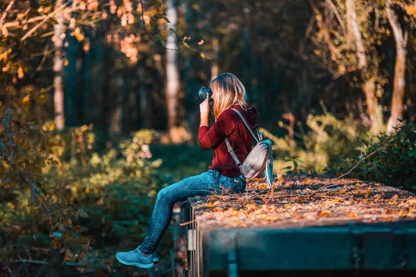 woman taking photos outside