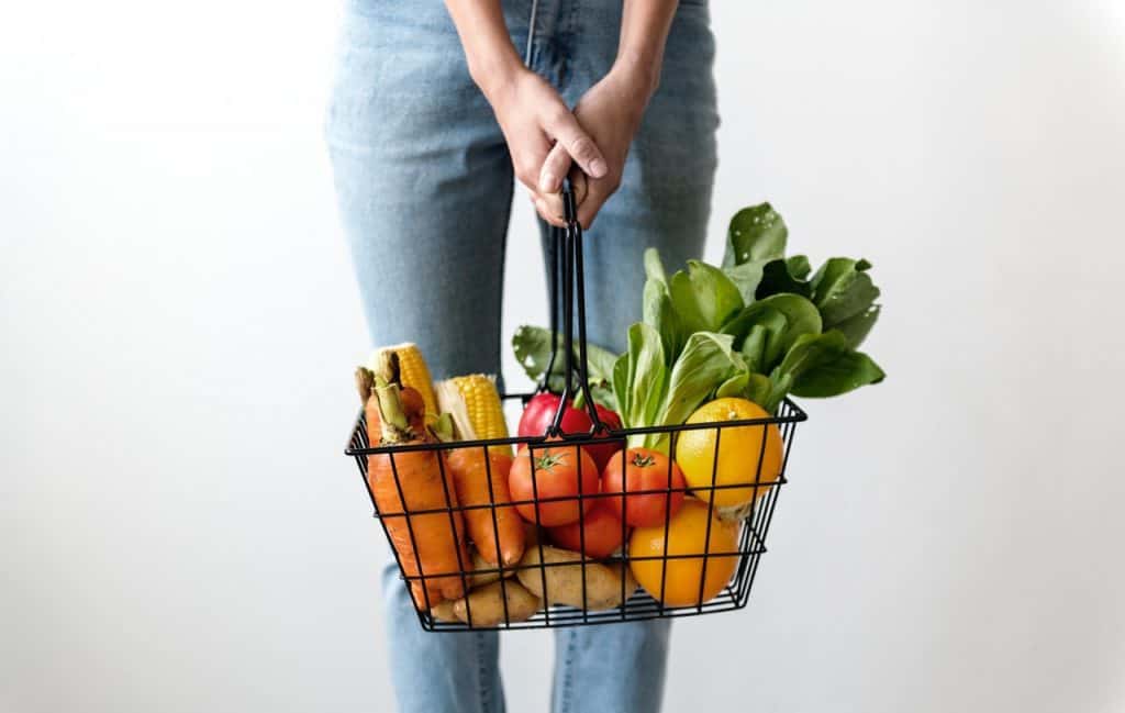 Woman holding grocery basket