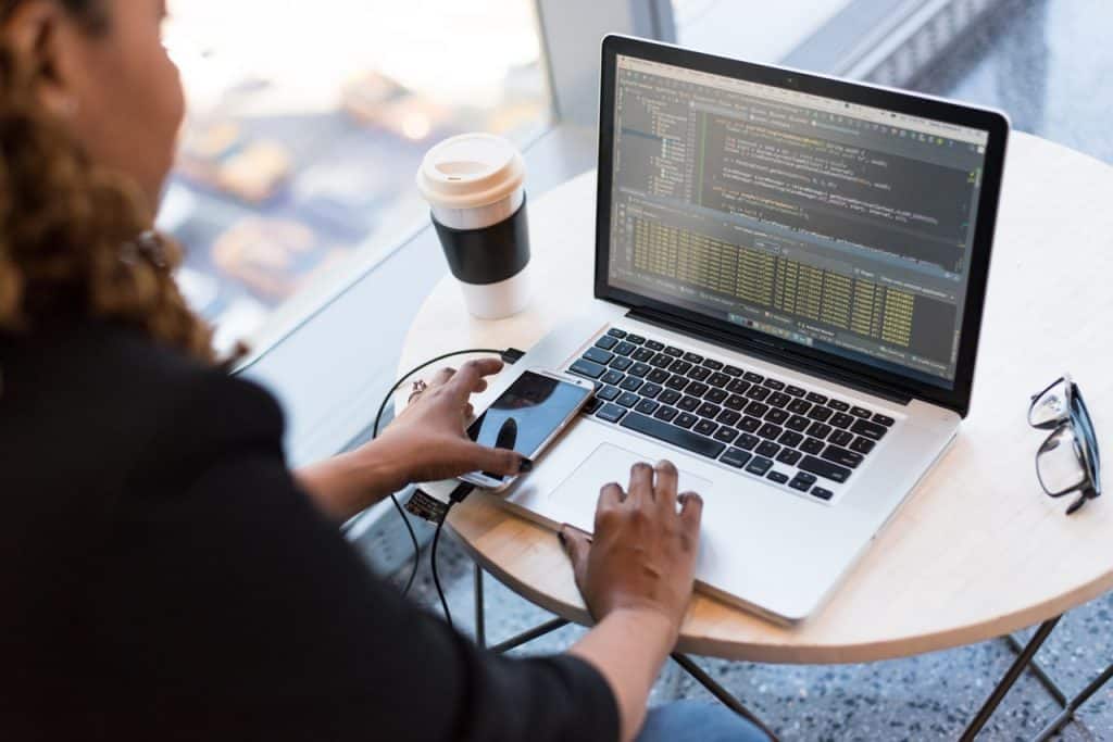 woman coding on computer