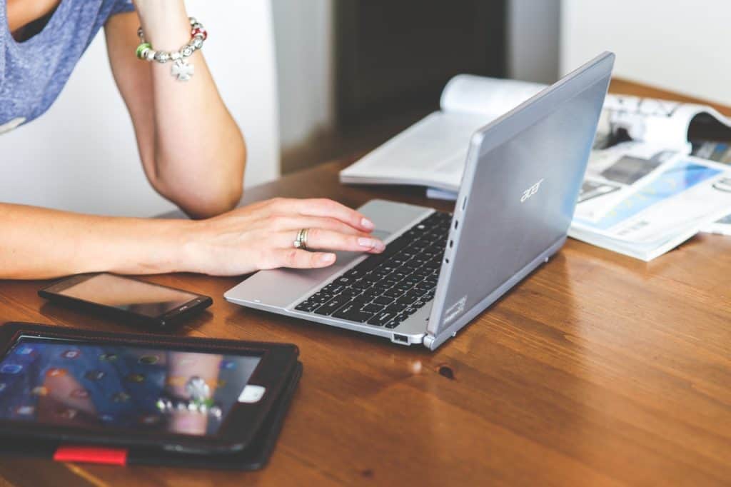 woman with laptop and tablet